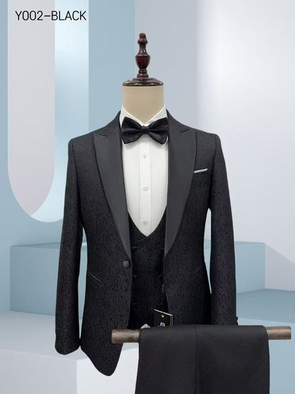 Black jacquard tuxedo suit with satin lapels, waistcoat, and bow tie on display
